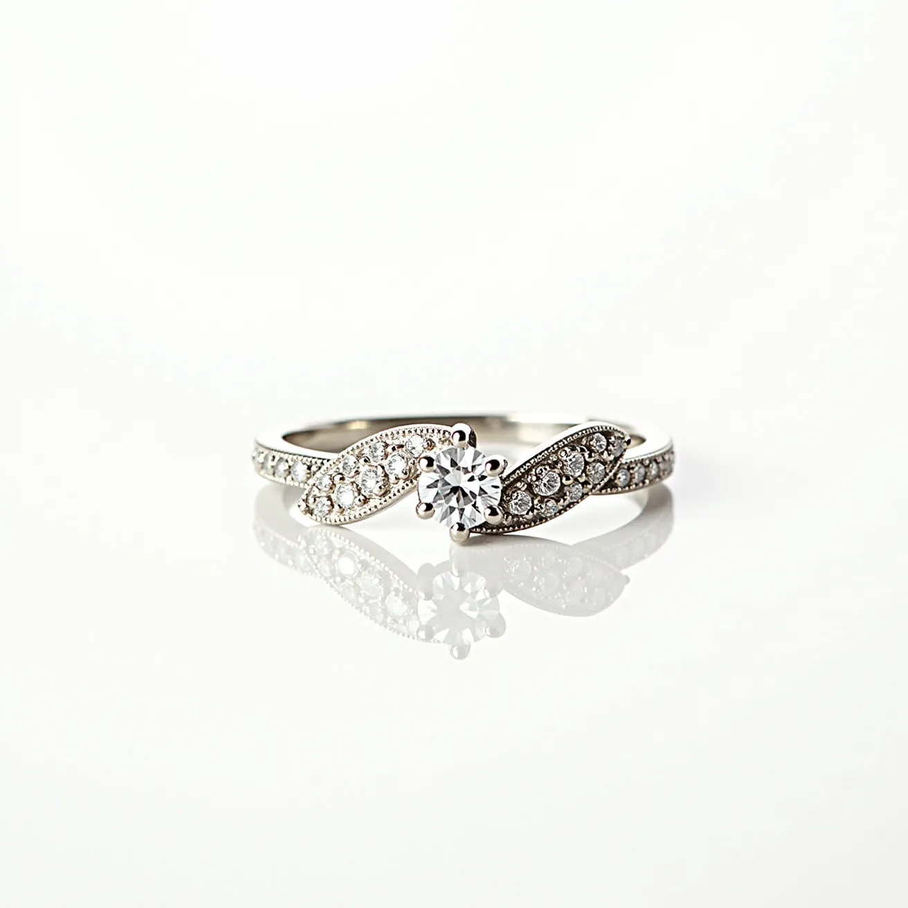 This stackable engagement ring features a delicate design crafted from a polished metal, likely white gold or platinum, which complements the overall elegance. At its heart lies a round-cut central diamond, set in a classic prong setting that elevates and secures the stone, allowing for maximum light reflection. The band is intricately adorned with smaller round-cut diamonds in a pavé setting, creating a shimmering, ribbon-like effect along the band. The thoughtful arrangement of these smaller diamonds enhances the ring's brilliance and offers a sparkling appearance from all angles.