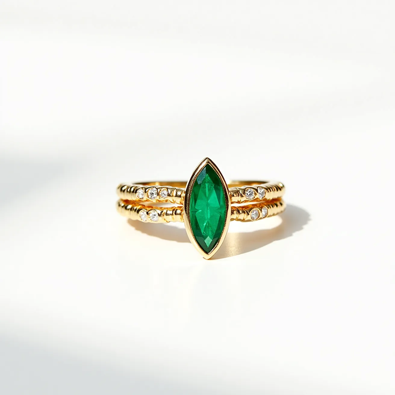 These stacked wedding rings are composed of gold bands that present an elegant and refined appearance. The central feature is a prominent marquise-cut green gemstone set vertically, which captures attention with its elongated shape and vibrant hue. The bands are adorned with small, round, white gems, possibly diamonds, set in a pave setting that adds a touch of sparkle alongside the primary stone. The combination of the marquise cut and the small round stones highlights a balance of sophistication and intricate design. The overall style conveys a classic yet modern elegance through the use of rich colors and exquisite gem arrangement.