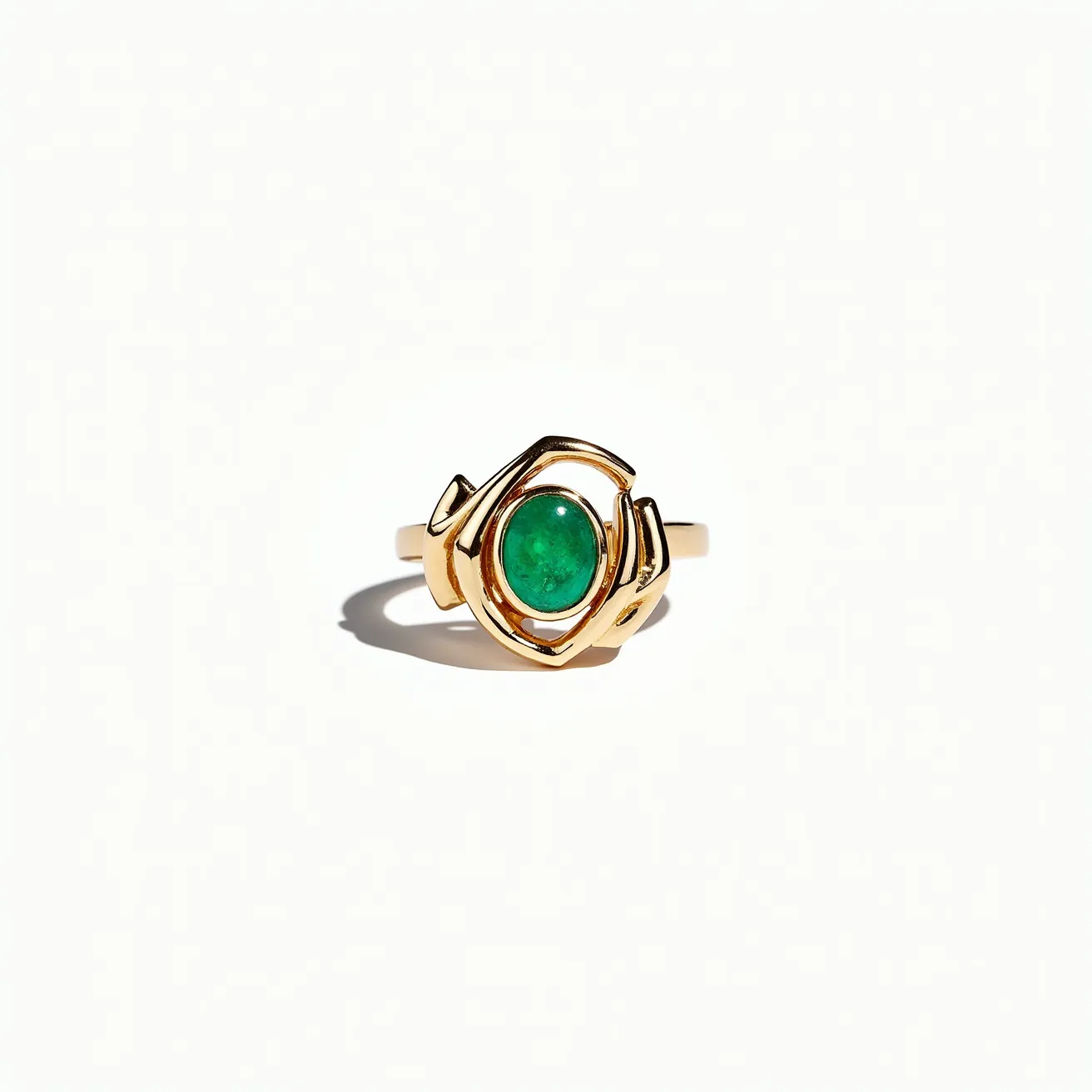 This statement ring showcases a vibrant green gemstone, likely an emerald, which is set prominently in a bezel setting. The band is crafted from a lustrous gold material, enhancing its luxurious appearance. The design features a unique and artistic representation of hands cradling the gemstone, creating a focal point that draws the eye. The smooth and polished finish of the gold gives the ring an elegant and refined look, making it a striking piece of jewelry.