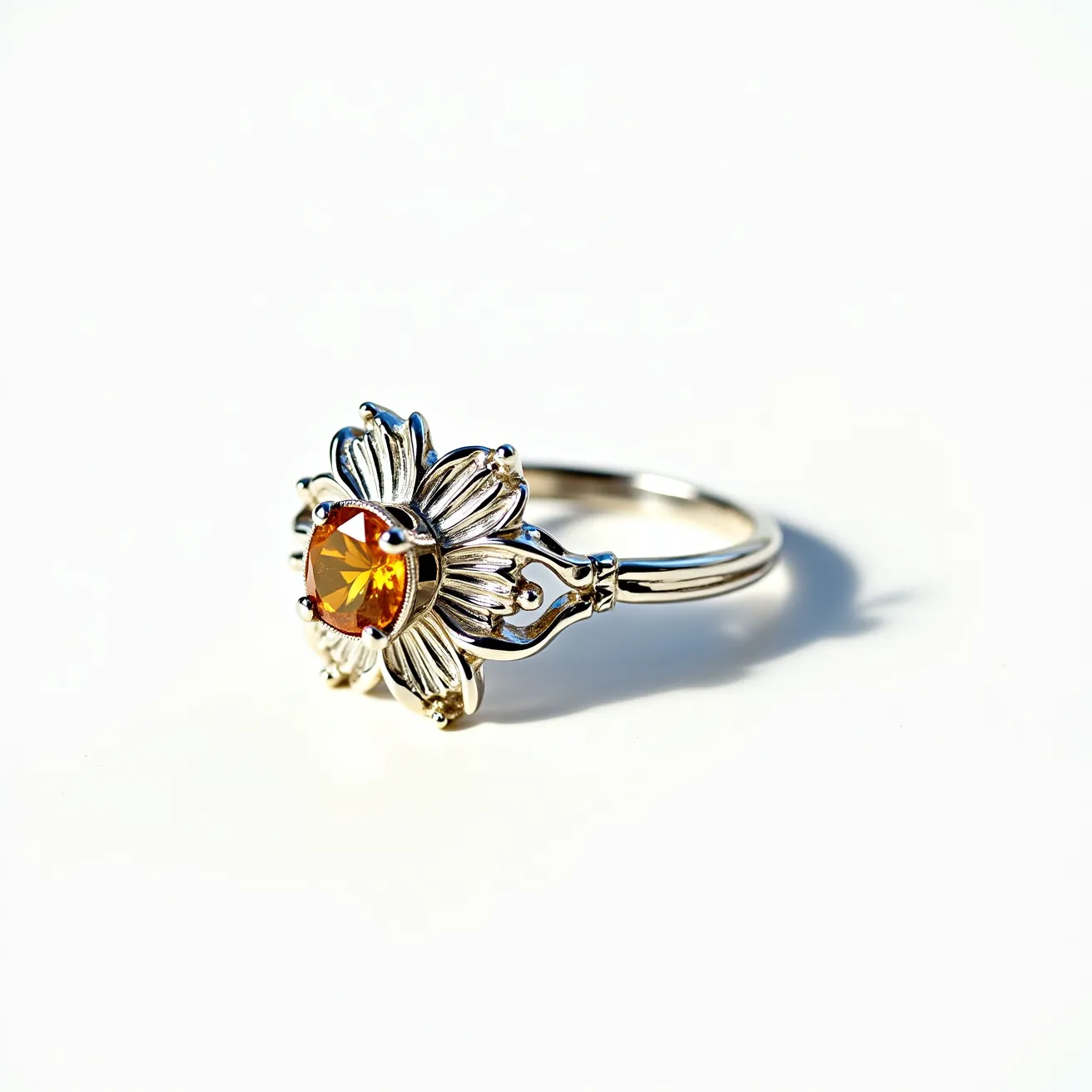 This sunflower ring features a silver band intricately crafted to resemble the petals of a sunflower, showcasing impressive detail in the design. At its center, a vibrant round-cut amber gemstone is set, accentuating the floral motif in a bezel setting. The gem's warm hues complement the silver tones of the ring, creating a striking contrast. The band is smooth and polished, providing comfort and elegance. The overall craftsmanship highlights a blend of natural inspiration with the refined elegance of jewelry design.