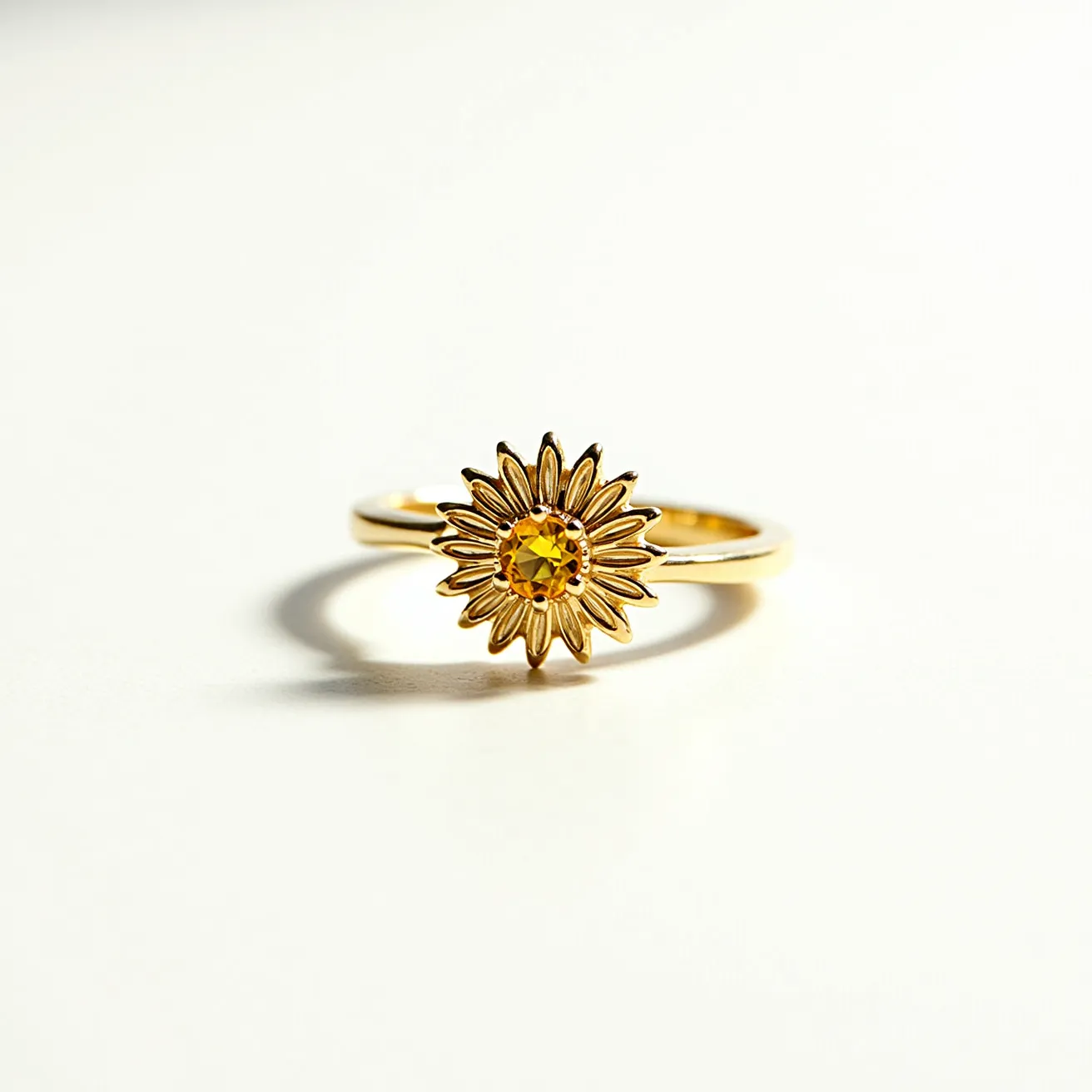 This sunflower ring showcases an elegant design crafted from a gold-colored metal, with a detailed sunflower motif at its center. The centerpiece features a round, faceted yellow gemstone that resembles the vibrancy of a sunflower's core, adding a touch of sparkle and depth to the piece. The sunflower's petals are intricately formed, radiating outward in a manner that enhances the floral design. The ring band is smooth and polished, indicating careful craftsmanship, and it seamlessly joins the sunflower top, ensuring a unified and attractive appearance. No additional attachments or clasps are present, emphasizing its simplicity and focus on the sunflower theme.