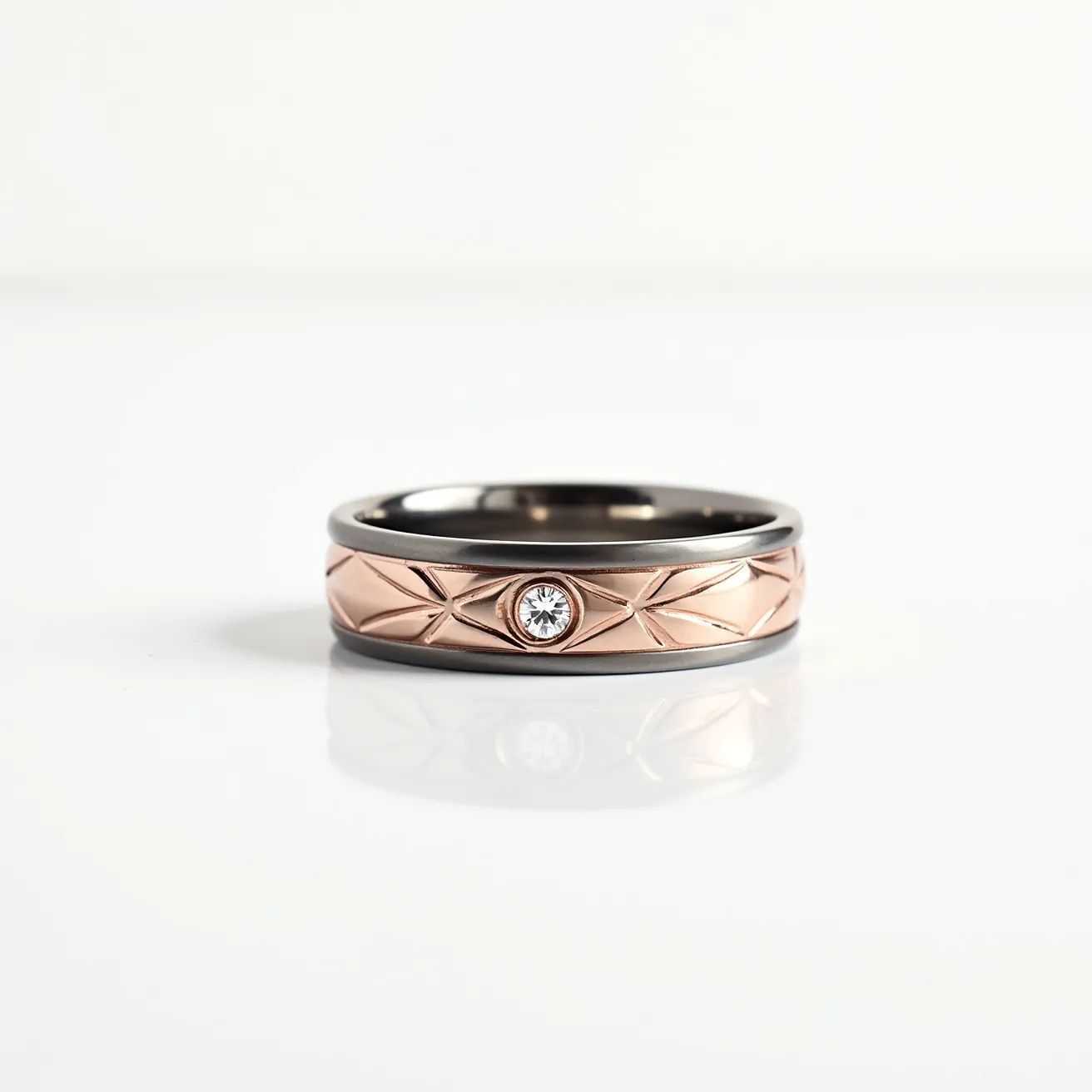 This tungsten ring features a sleek, polished finish with an interior band that appears to be of a dark tungsten material, enhancing its durability and modern aesthetic. The outer band showcases a distinctive rose gold inlay with a detailed, geometric pattern, accentuating the ring's contemporary design. At the center of the ring lies a single clear gemstone, likely a diamond or cubic zirconia, set in a bezel setting which provides a secure and stylish mounting. The combination of tungsten and rose gold elements, along with the central gemstone, creates a striking and elegant appearance.