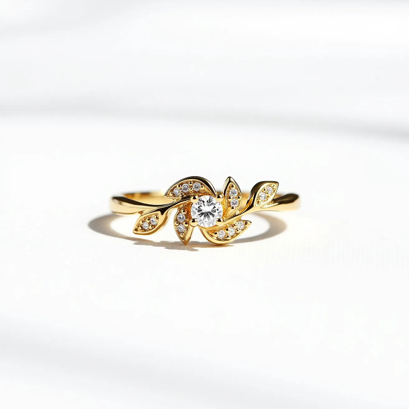 This vine engagement ring features a delicate and intricate design with a gold band that elegantly mimics the natural flow of a vine. The focal point is a round brilliant-cut diamond set at the center, surrounded by leaf-shaped accents encrusted with smaller diamonds, enhancing its brilliance. The gold craftsmanship showcases an organic theme, with the twisted band resembling vine tendrils gracefully enfolding the central stone. The diamonds are securely set, allowing light to play off their surfaces, creating a stunning sparkle.