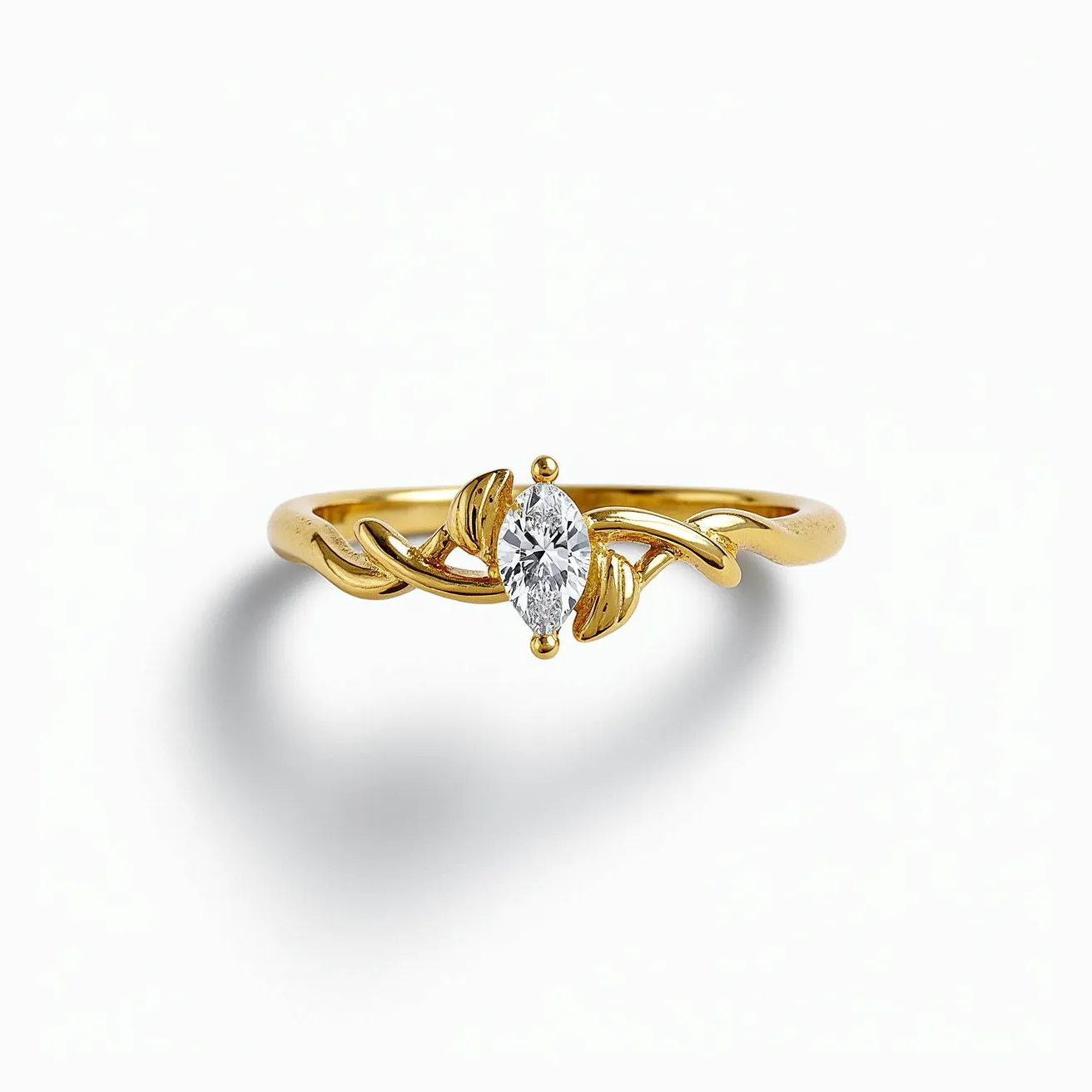 This vine ring features a beautifully crafted gold band that gracefully twists in a vine-like design. At its center, the ring displays a marquise-cut diamond, securely held in a prong setting, which enhances its brilliance and elegance. The gold band's delicate curves complement the central stone, creating a harmonious and nature-inspired look. The ring does not appear to have any additional clasps or attachments, relying on its minimalist yet sophisticated design to make a statement.