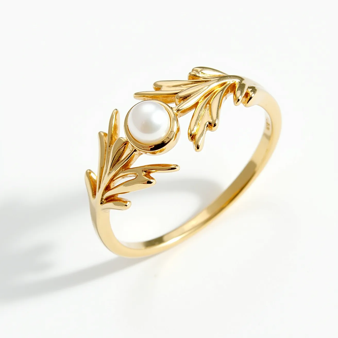 This vine ring features a delicate and intricate design crafted from a polished yellow gold material. It showcases a single, round pearl set elegantly in the center, accentuated by two detailed leaf motifs that extend from either side, enhancing its organic and natural aesthetic. The pearl is smoothly polished, offering a lustrous contrast that complements the leaf design. The ring's shank is sleek and seamless, without any visible clasps or additional attachments, emphasizing the fluid continuity of the vine-inspired structure.