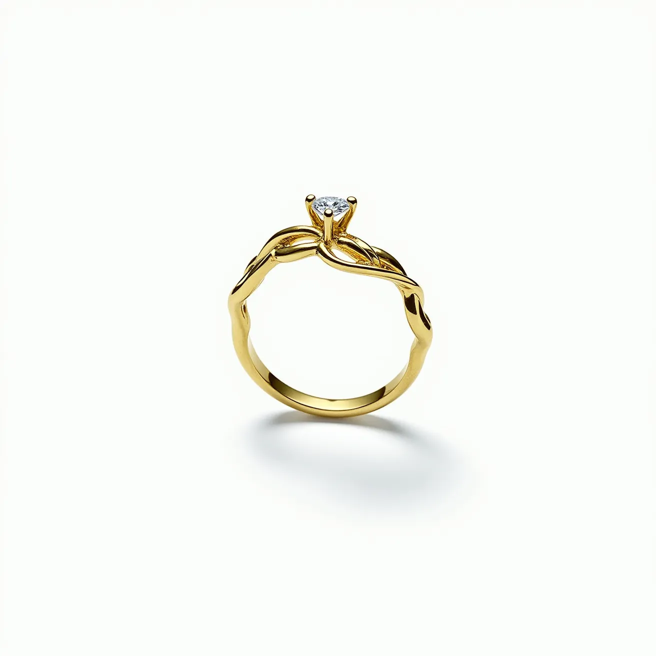 This vine ring elegantly intertwines a band of polished gold, mimicking the graceful twists of vines. At its center, a single round-cut diamond is prominently set in a four-prong setting, allowing light to enhance its brilliance. The design showcases meticulous craftsmanship with its organic and flowing form, perfectly integrating the gem into the band’s structure without the use of additional clasps or attachments.