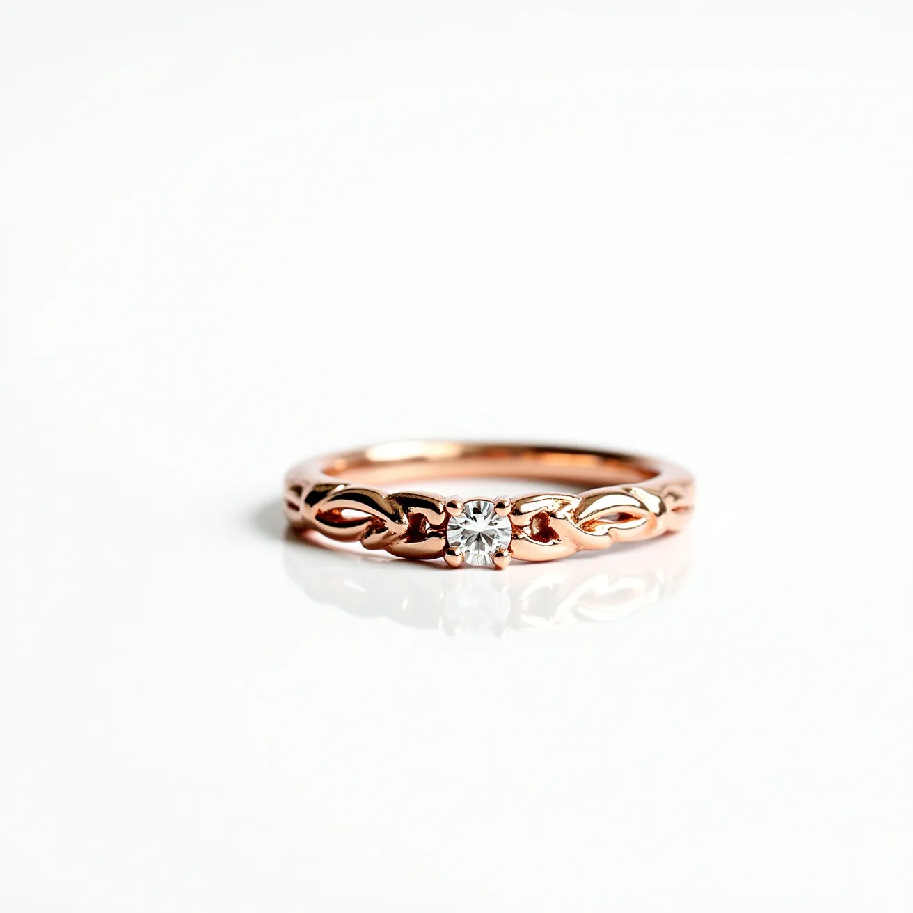 This wedding band is crafted from a warm rose gold material, which gives it a distinctive reddish hue. It features an intricate openwork design with flowing, organic patterns that enhance its elegant appearance. The band is adorned by a single round-cut diamond set prominently at the center, held securely by a bezel setting that showcases the stone's brilliance. The combination of rose gold and the sparkling diamond creates a classic yet unique look, making it a sophisticated and timeless piece.