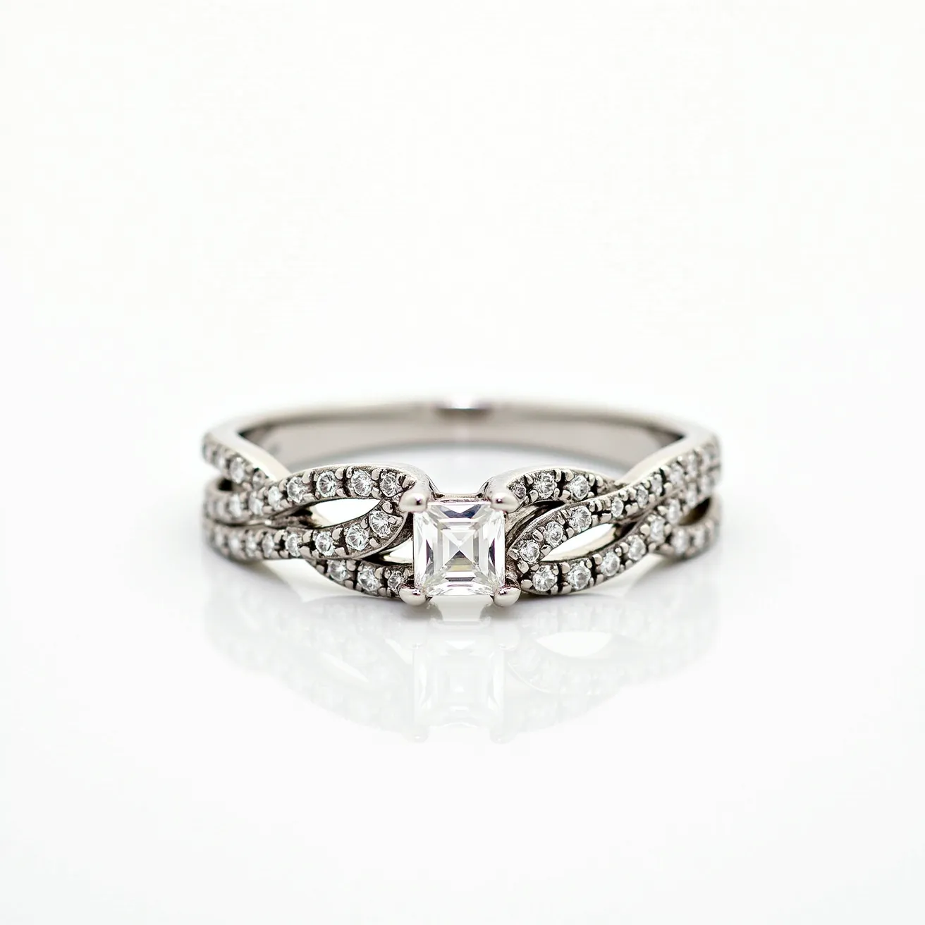 This wedding ring features a delicate, intertwined band made of white metal, possibly white gold or platinum, that enhances its elegant appearance. It is adorned with a series of small, round-cut diamonds set in a pavé arrangement, creating a shimmering effect along the band. The centerpiece is a striking square-cut diamond, likely an Asscher cut, held securely in a four-prong setting, adding a classic and sophisticated touch. This design elegantly combines modernity and tradition, making it a stunning symbol of commitment.