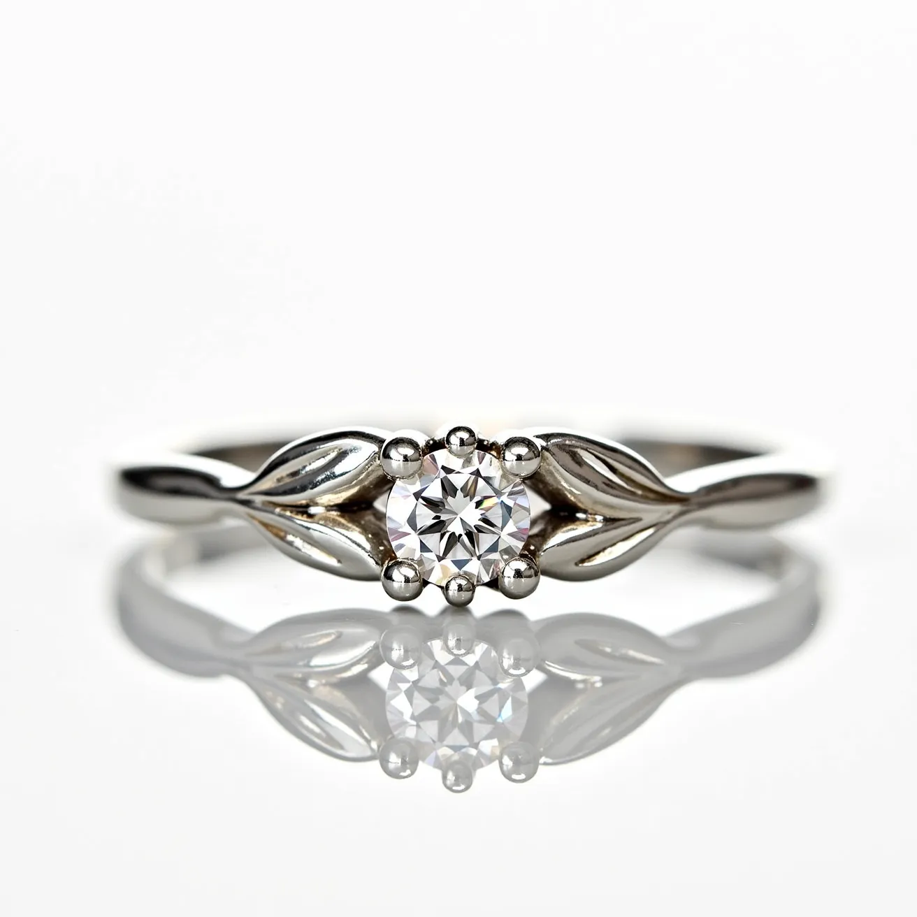 This wedding ring features a band crafted from a shiny, reflective metal, likely platinum or white gold. It is adorned with a single round-cut diamond, held in place by a delicate prong setting. The diamond is positioned centrally, flanked by a leaf-like design on both sides, adding an elegant, nature-inspired touch to the overall aesthetic of the ring. The simplicity of the setting highlights the brilliance of the diamond, allowing it to be the focal point of the piece.