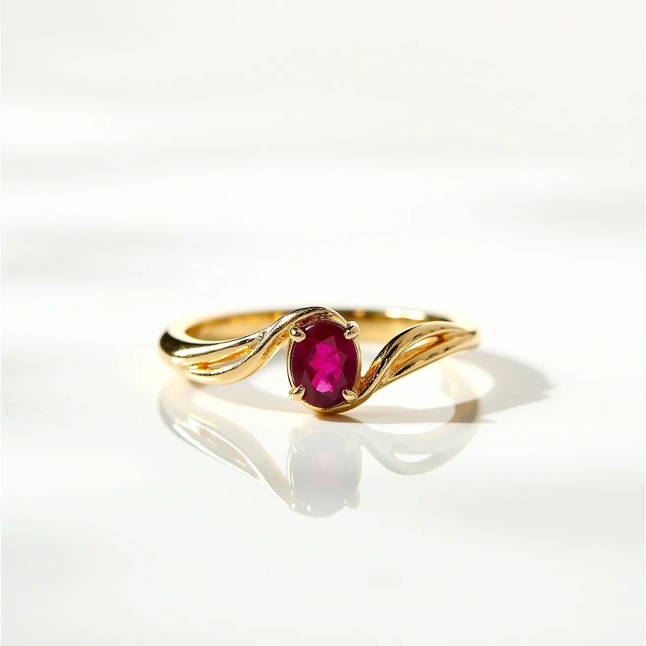 This unique wedding ring features a beautifully intertwined gold band, highlighting its elegant and sophisticated design. At its center is a striking oval-cut ruby, set in a secure four-prong setting that allows the vibrant red hue of the stone to stand out. The twisted design of the band adds a dynamic, fluid element to the ring's overall appearance, artfully complementing the brilliant gemstone. The gold's warm tones enhance the depth of the ruby, creating a harmonious and eye-catching combination.